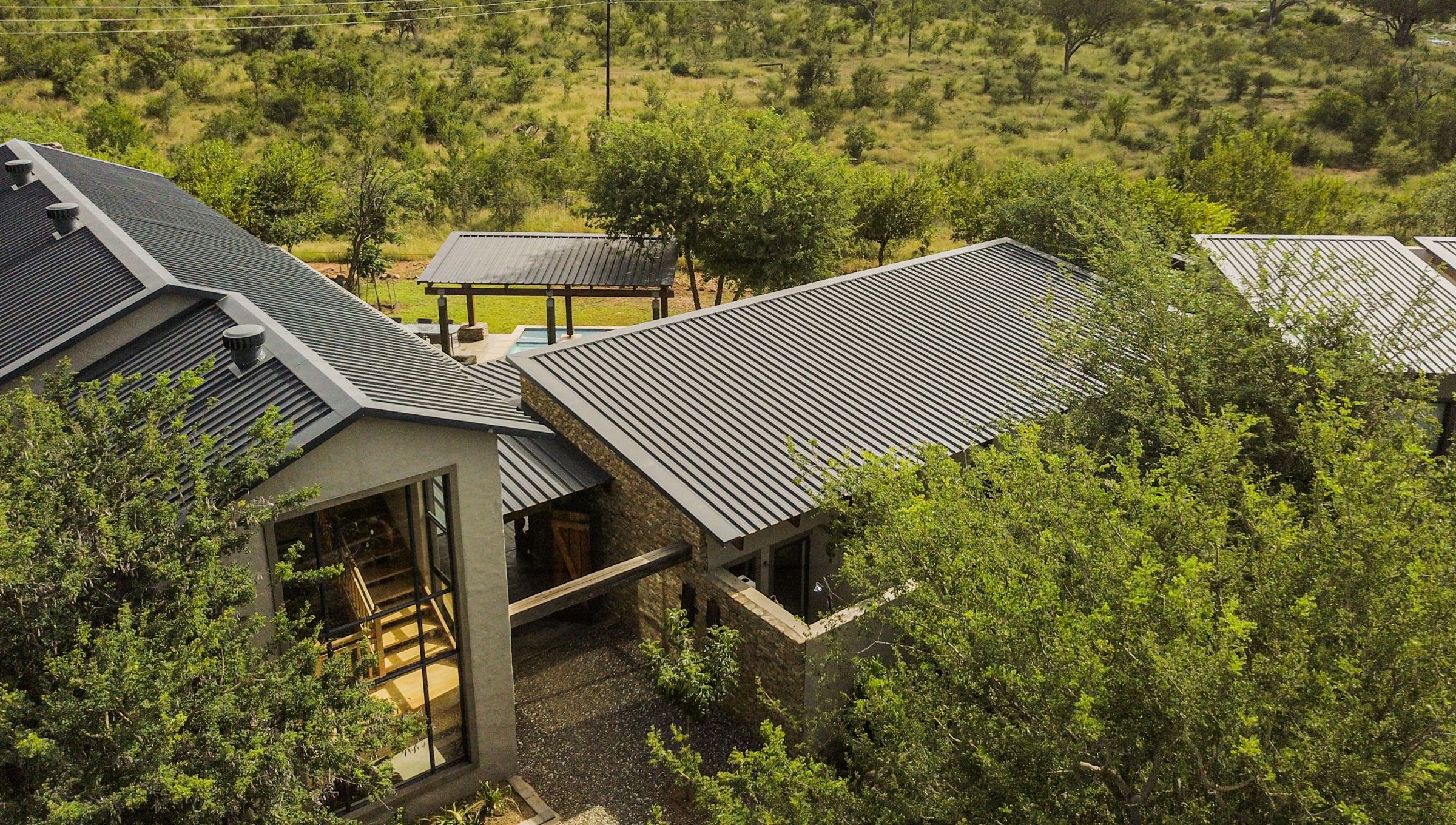 The lodge, nestled in the bush.